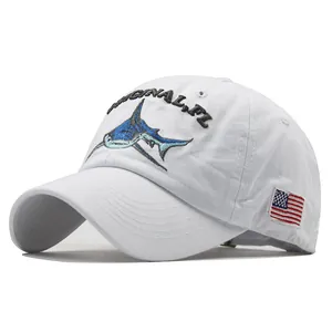 White washed cotton baseball cap with embroidered shark and US flag patch detail