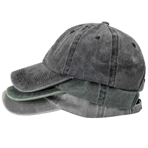 Stack of washed distressed cotton baseball caps in various vintage faded colors for men