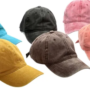 Group of vintage washed cotton baseball caps in multiple colors for a distressed look.