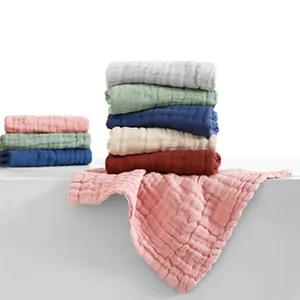Stack of colorful soft cotton muslin gauze blankets for infants and kids