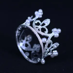 Macro detail of silver alloy mini crown with elegant pearl decorations