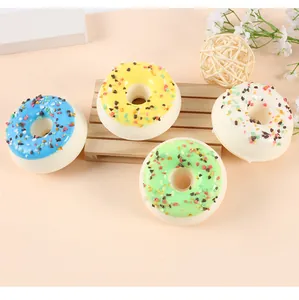 Detail view of colorful simulation donut fridge magnets with realistic sugar sprinkles