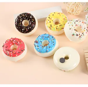 Realistic artificial donut fridge magnets showing styles and magnetic backing detail