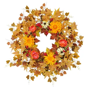 Autumn Thanksgiving wreath decorated with maple leaves, mini pumpkins and orange flowers