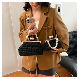 Detailed view of black rhinestone clutch bags with elegant pearl handles in two sizes