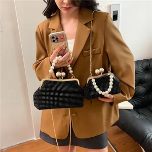 Black rhinestone evening clutch bag with pearl handle and chain strap