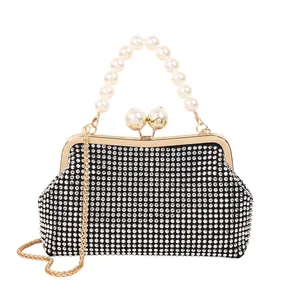 Elegant black shell clutch bag with pearl handle and sparkling rhinestones for party