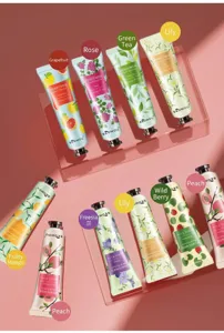 A collection of assorted hydrating hand creams with floral and fruit essence in colorful tubes.