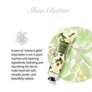 Detailed view of Shea Butter Perfumed Hand Essence tube featuring elegant botanical illustrations