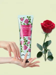 Detailed view of Rose Perfumed Hand Essence tube with rose flower and application scene