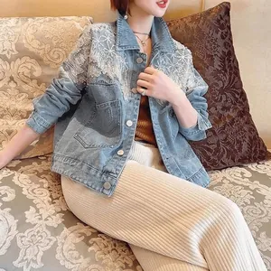 Detail view of a light blue denim jacket with sequin and lace shoulder accents