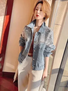 Stylish light blue denim jacket for women featuring heavy sequin starburst embroidery detail