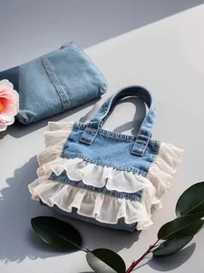 Stylish washed denim tote bag featuring elegant white double ruffle trim and top handles