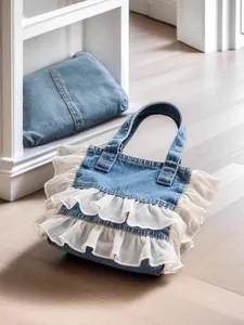 Stylish washed denim tote bag featuring elegant white double-layer ruffle lace detailing