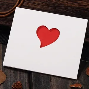 Elegant white greeting card featuring a hollow red heart and I miss you text with envelope