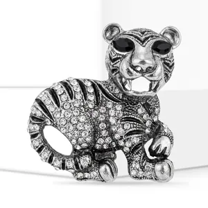 Close-up view of a vintage alloy tiger brooch featuring sparkling rhinestone details