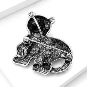 Detailed back view of vintage silver-tone tiger brooch with textured alloy finish
