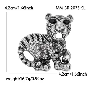 Vintage silver tiger brooch with sparkling rhinestones and black crystal eyes pin