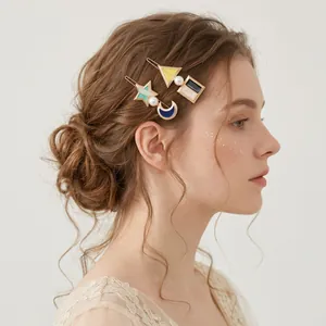 Forest style enamel geometric hair clips set with faux pearls on blonde wavy hair