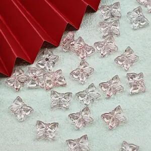 High-quality close-up of transparent pink butterfly glass beads for handmade DIY jewelry making