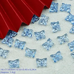 Detail view of blue transparent butterfly beads for DIY jewelry making and handmade accessories
