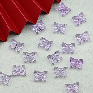 Detail view of purple translucent butterfly beads for DIY jewelry making