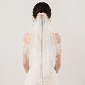 Elegant double-layer bridal veil with pearl flower hair comb accessory