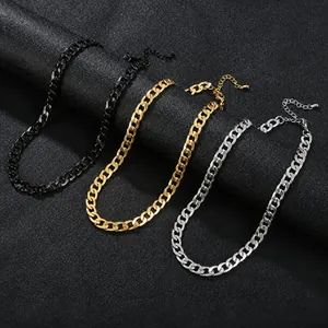 Close-up of stainless steel Cuban link necklaces in gold, silver, and black finishes