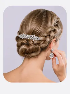 Close-up of luxury bridal crystal hair clip and earrings set for bun hairstyle