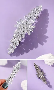 Detail view of an elegant marquise-cut crystal hair clip on a purple background