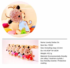 Detailed view of cute rhinestone cartoon cow keychain with size and material specs