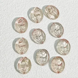 Close-up of 15x18mm oval pink glass beads with rose pattern for jewelry making