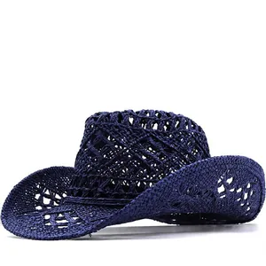 Macro detail view of navy blue hollow-out woven cowboy straw hat with curved brim