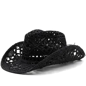 Macro detail of black hand-woven breathable straw cowboy hat featuring hollow patterns