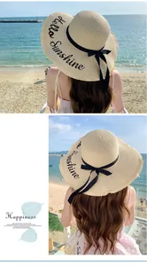 Stylish wide brim straw sun hat with Hello Sunshine embroidery for beach vacations