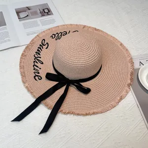 Wide brim straw sun hat for women with Hello Sunshine embroidery and black bow