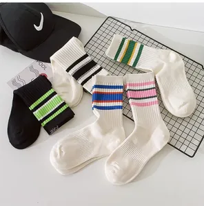Close-up detail of multi-colored striped cotton crew socks with ribbed knit texture