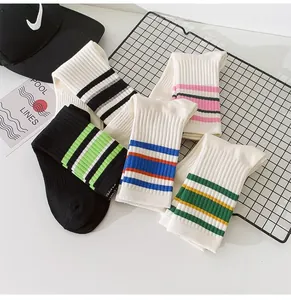 Detailed view of trendy striped cotton crew socks for women in multiple vibrant colors