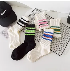 Close-up of colorful striped athletic mid-calf socks arranged on a display grid