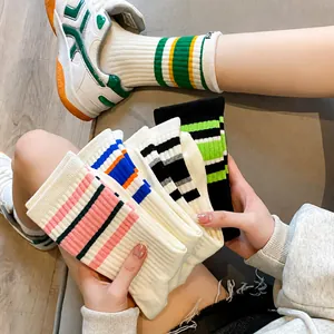 Women's streetwear trendy striped athletic crew socks in five vibrant color combinations