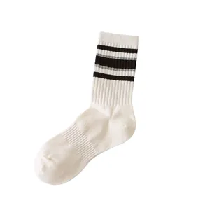 White mid-calf cotton athletic socks with black stripes for women's trendy street style