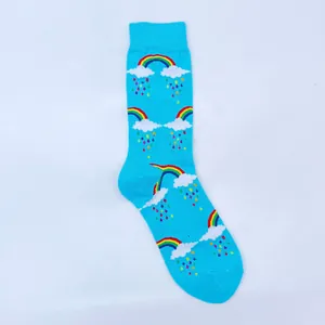 Macro view of vibrant rainbow and cloud jacquard pattern on sky blue cotton crew socks
