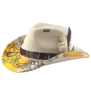 Beige wool felt fedora hat featuring floral printed brim and western style feather decoration