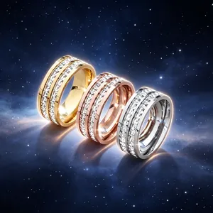 Detailed view of three stainless steel rings with double-row crystals in cosmic theme.
