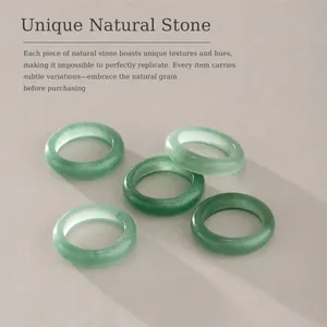 Detailed view of natural green stone rings showing unique variations and textures.