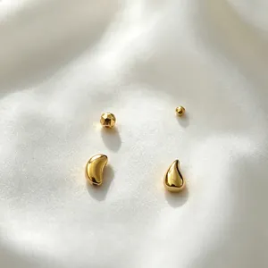 Detailed view of gold plated stainless steel bean and faceted beads for DIY jewelry crafts
