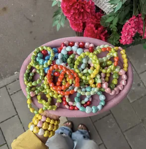 Detailed view of colorful heart-shaped beaded bracelets in vibrant candy colors