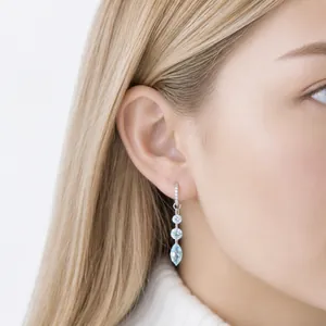 Elegant crystal drop earrings with light blue stones on a titanium alloy hoop design.