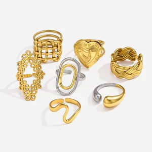 Detailed view of various minimalist 18k gold-plated and silver stainless steel rings