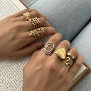 Close-up of elegant 18k gold-plated stainless steel rings in various hollow designs